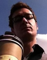 man holding coffee cup